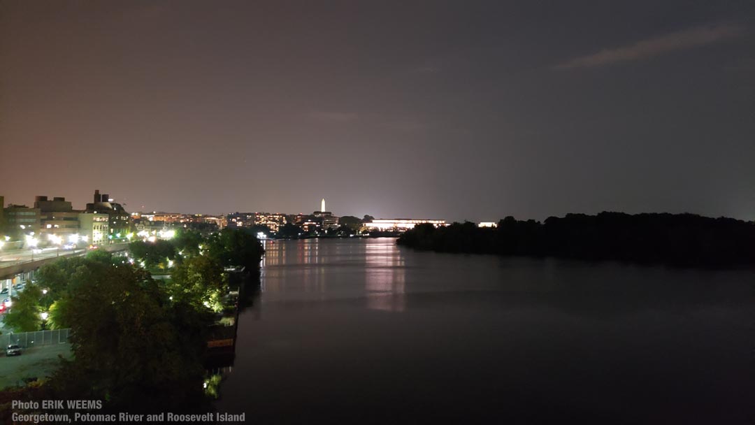 Over the Potomac at night with Roosevelt Island