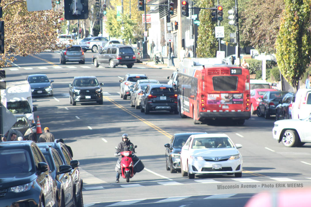 A Fireman on a Scooter on Wisconsin Ave