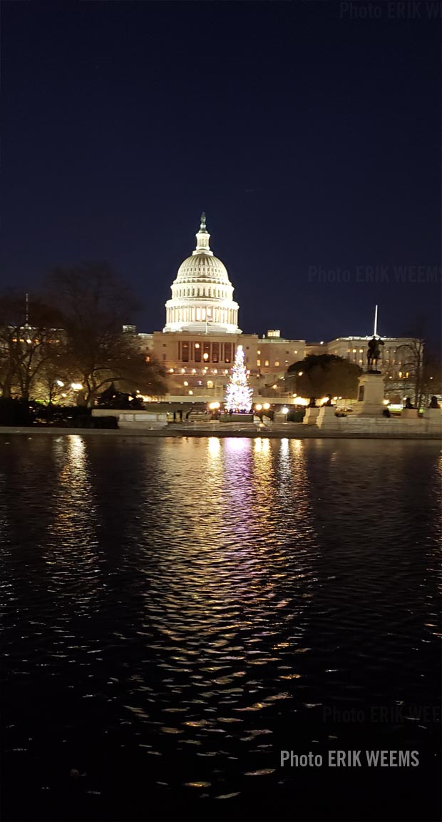 At night at the reflecting waters at teh Capitol Dome