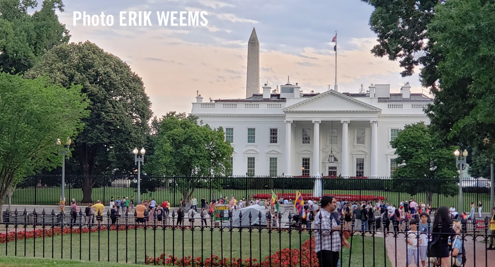 White House with tourists and washington Monument