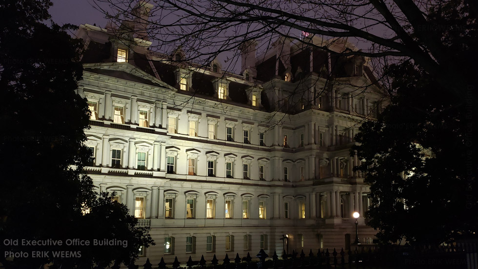 The Old Executive Office Building at night by Lafayette Park and the White House