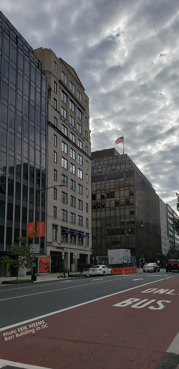 Clouds rolling in over Farragut Park and the Barr Building in DC
